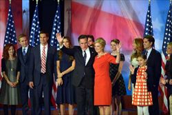 Mitt Romney con la sua famiglia al convention center di Boston la notte delle elezioni (Ansa).