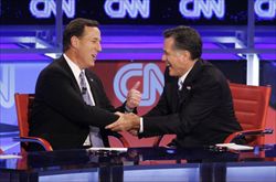 I rivali repubblicani Rick Santorum e Mitt Romney durante un dibattito televisivo (Reuters)