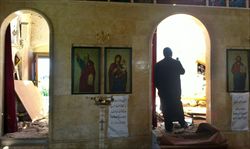 Una chiesa greco-ortodossa nel villaggio di Dweir, vicino a Homs, danneggiata dalla guerra (Ansa).